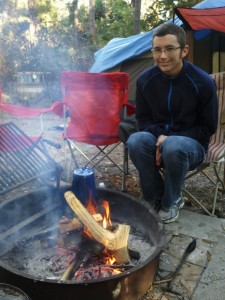 Enjoying a campfire at camp